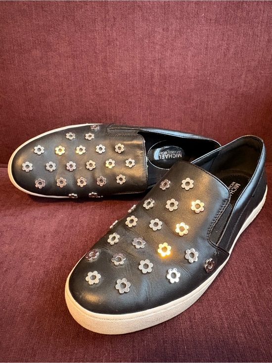 MICHAEL Michael Kors Shoes - MICHAEL Michael Kors Black Slip-On Sneakers with Silver Flower Studs Women’s